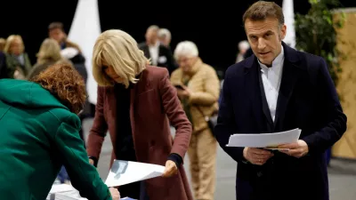 FILE PHOTO: French President Emmanuel Macron and his wife Brigitte Macron attend voting during the first round of France's municipal elections in Le Touquet-Paris-Plage, France, Sunday, March 15, 2026. Jean-Francois Badias/Pool via REUTERS   TPX IMAGES OF THE DAY/File Photo