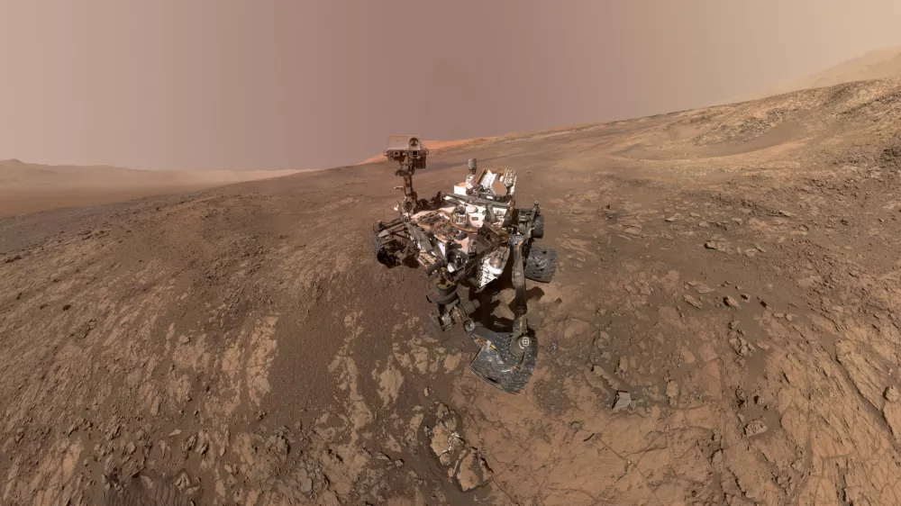 FILE - This composite image made from a series of Jan. 23, 2018 photos shows a self-portrait of NASA's Curiosity Mars rover on Vera Rubin Ridge. On Thursday, June 7, 2018, scientists said the rover found potential building blocks of life in an ancient lakebed and confirmed seasonal increases in atmospheric methane. The rover's arm which held the camera was positioned out of each of the dozens of shots which make up the mosaic. (NASA/JPL-Caltech/MSSS via AP)