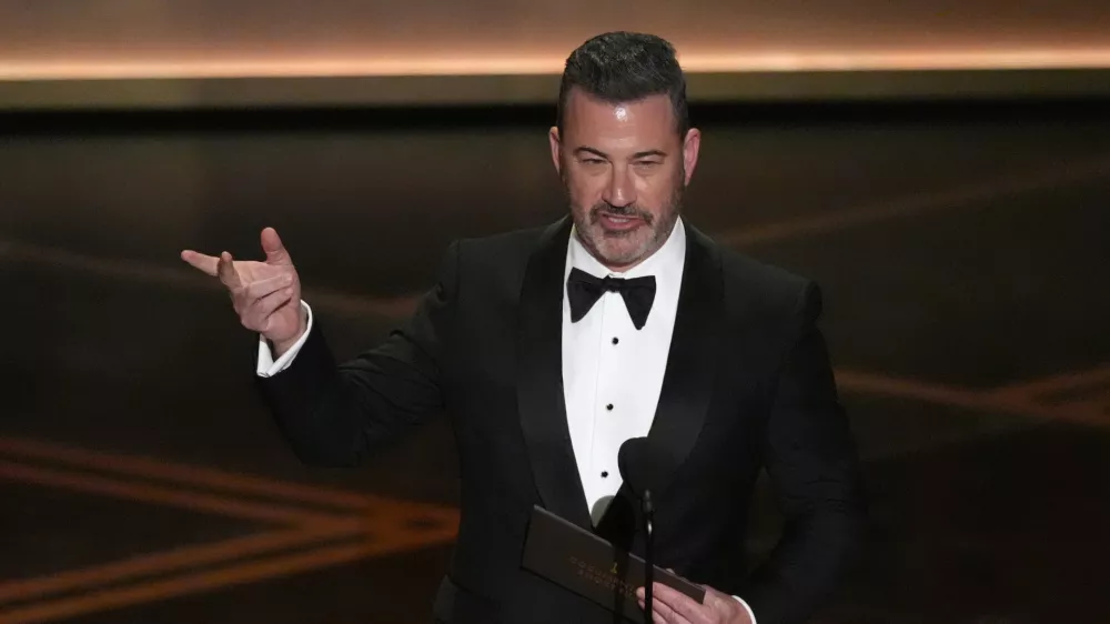 Jimmy Kimmel presents the award for best documentary short film during the Oscars on Sunday, March 15, 2026, at the Dolby Theatre in Los Angeles. (AP Photo/Chris Pizzello)