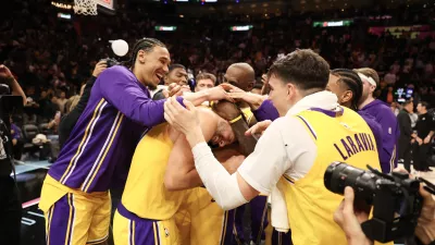 Mar 19, 2026; Miami, Florida, USA; Los Angeles Lakers team celebrates Luka Doncic (77) after 60 point game against the Miami Heat at Kaseya Center. Mandatory Credit: Isabella Frias-Imagn Images