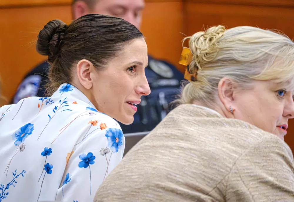 Defendant Kouri Richins, left, accused of poisoning her husband in March 2022, listens to closing arguments in Third District Court, Monday, March 16, 2026, in Park City, Utah. (David Jackson/Pool Photo via AP)