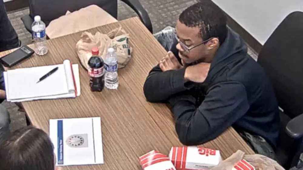 FILE - This image from video contained in a Justice Department court filing shows Brian J. Cole Jr., being interrogated by FBI investigators in Woodbridge, Va., Dec. 4, 2025. (Justice Department via AP)