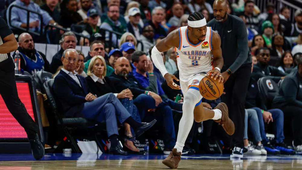 Oklahoma City Thunder guard Shai Gilgeous-Alexander (2) brings the ball down court against he Orlando Magic during the second half of an NBA basketball game Tuesday, March 17, 2026, in Orlando, Fla. (AP Photo/Kevin Kolczynski)