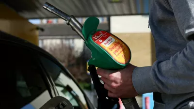 FILE PHOTO: A motorist returns the petrol pump after filling their car with fuel at a petrol station, as the price of oil and gas has surged amid the conflict in the Middle East, in London, Britain, March 5, 2026 REUTERS/Jack Taylor/File Photo