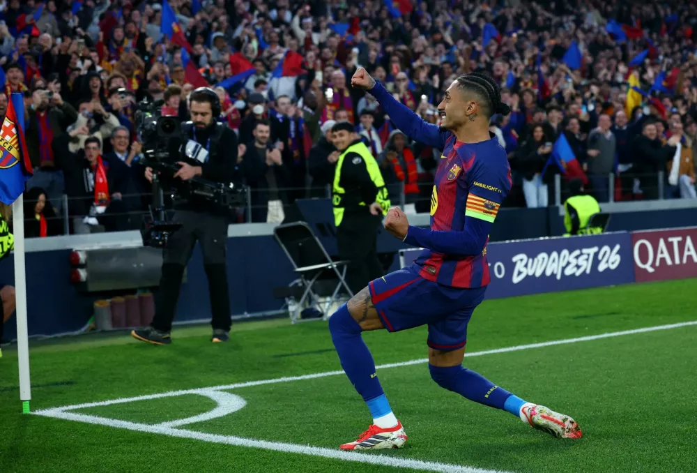 Soccer Football - UEFA Champions League - Round of 16 - Second Leg - FC Barcelona v Newcastle United - Spotify Camp Nou, Barcelona, Spain - March 18, 2026 FC Barcelona's Raphinha celebrates scoring their first goal REUTERS/Albert Gea