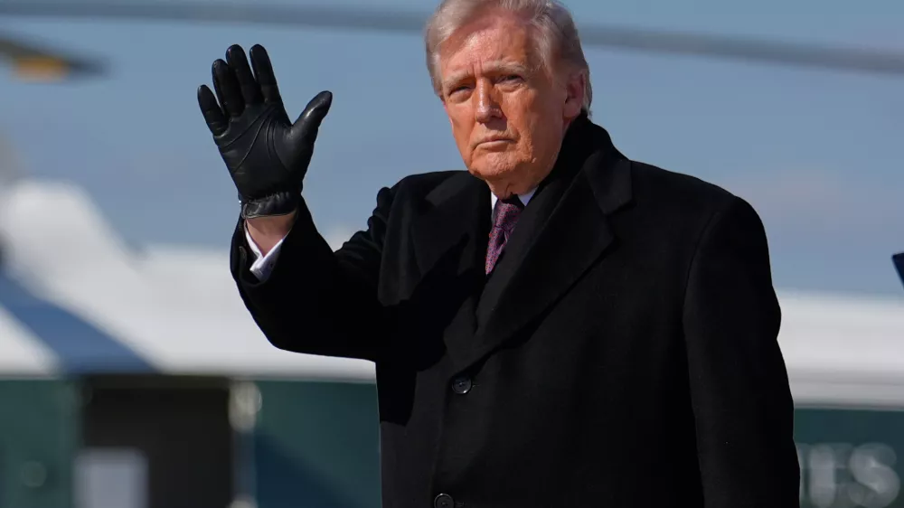 President Donald Trump waves after arriving on Air Force One, Wednesday, March 18, 2026, at Joint Base Andrews, Md., after attending the casualty return at Dover Air Force Base, Del., for the six crew members of an Air Force refueling aircraft who died when their plane crashed in western Iraq while supporting operations against Iran. (AP Photo/Julia Demaree Nikhinson)