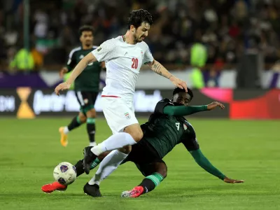FILE PHOTO: Soccer Football - World Cup - AFC Qualifiers - Third Round - Group A - Iran v United Arab Emirates - Azadi Sports Complex, Tehran, Iran - March 20, 2025 Iran's Sardar Azmoun in action with United Arab Emirates' Kouame Kouadio Majid Asgaripour/WANA (West Asia News Agency) via REUTERS  ATTENTION EDITORS - THIS IMAGE HAS BEEN SUPPLIED BY A THIRD PARTY./File Photo