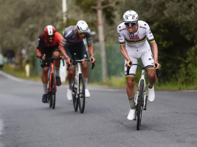 From left, second-placed Filippo Ganna, winner Mathieu van der Poel and third-placed Tadej Pogacar compete in the men's elite race of the Milano-Sanremo one day cycling race (289 km) from Pavia, in Sanremo, Italy, Saturday March 22, 2025. (Gian Mattia D'Alberto/LaPresse via AP)