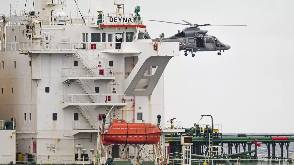 A French Navy helicopter hovers over the Deyna vessel, which is supposed to be a member of the Russian shadow fleet, during an operation in the Western Mediterranean Sea, in this handout image obtained by Reuters on March 20, 2026. Prefecture maritime de la Mediterranee/Etat Major des Armees/Handout via REUTERS  THIS IMAGE HAS BEEN SUPPLIED BY A THIRD PARTY