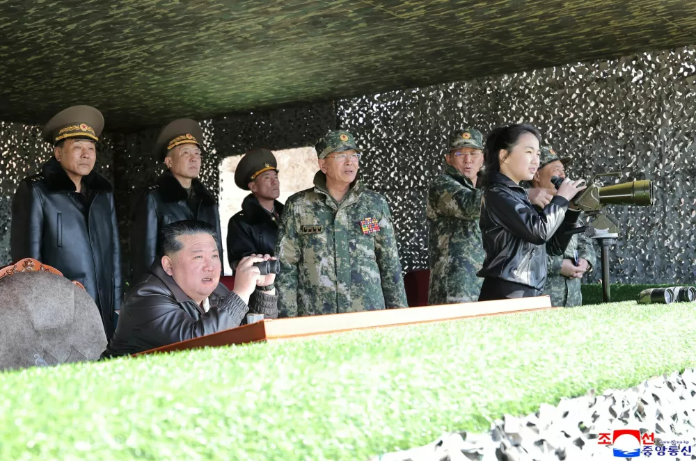 North Korean leader Kim Jong Un, accompanied by his daughter Kim Ju Ae, supervises what North Korean state news agency KCNA reports is an offensive tactical drill involving a new type of tank, at a training base in Pyongyang, North Korea, March 19, 2026, in this picture released by North Korea's official Korean Central News Agency. KCNA via REUTERS ATTENTION EDITORS - THIS IMAGE WAS PROVIDED BY A THIRD PARTY. REUTERS IS UNABLE TO INDEPENDENTLY VERIFY THIS IMAGE. NO THIRD PARTY SALES. SOUTH KOREA OUT. NO COMMERCIAL OR EDITORIAL SALES IN SOUTH KOREA.