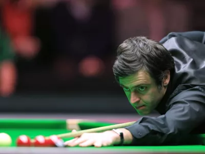 Ronnie O'Sullivan prepares to take a shot during the final of the Masters 2016 snooker tournament between Ronnie O'Sullivan and Barry Hawkins at Alexandra Palace, London, Sunday Jan. 17, 2016. (Adam Davy/PA via AP) UNITED KINGDOM OUT NO SALES NO ARCHIVE