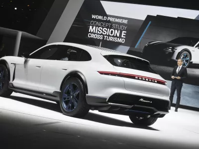 Oliver Blume, chairman of the board of Porsche, presenting Porsche's Mission E Cross Turismo during the first press day of the Geneva Motor Show in Geneva, Switzerland, 06 March 2018. This model is Porsche's presentation of a concept study for an electrical Cross Utility Vehicle (CUV). The 88th Geneva Motor Show starts on 08 March and ends on 18 March. About 180 exhibitors will be displaying 900 models and the organisers expect 700,000 visitors. Photo by: Uli Deck/picture-alliance/dpa/AP Images