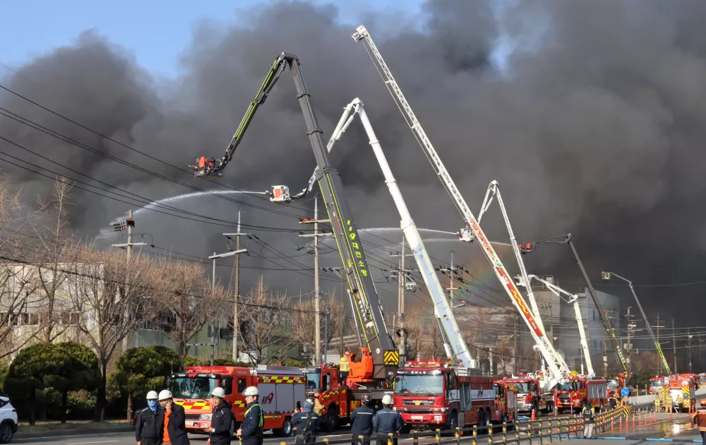 Black smoke rises from an auto parts plant in Daejeon, South Korea, Friday, March 20, 2026. (Kim June-beom/Yonhap via AP)