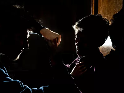 silhouette of two young guys in the dark place bully and fight concept