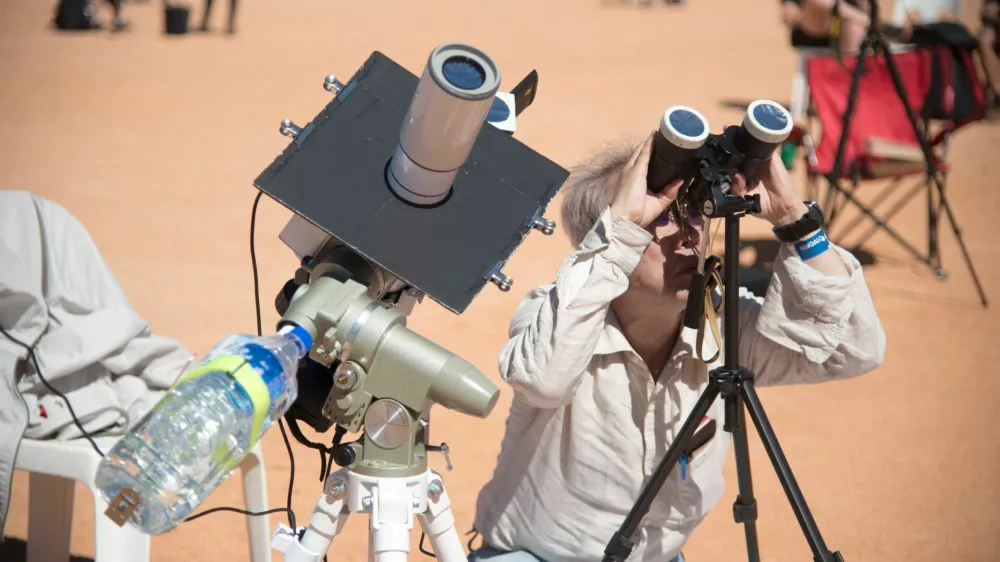 People watch a total solar eclipse at a viewing site 35km from Exmouth, Western Australia, April 20, 2023. AAP Image/Aaron Bunch via REUTERS ATTENTION EDITORS - THIS IMAGE WAS PROVIDED BY A THIRD PARTY. NO RESALES. NO ARCHIVE. AUSTRALIA OUT. NEW ZEALAND OUT
