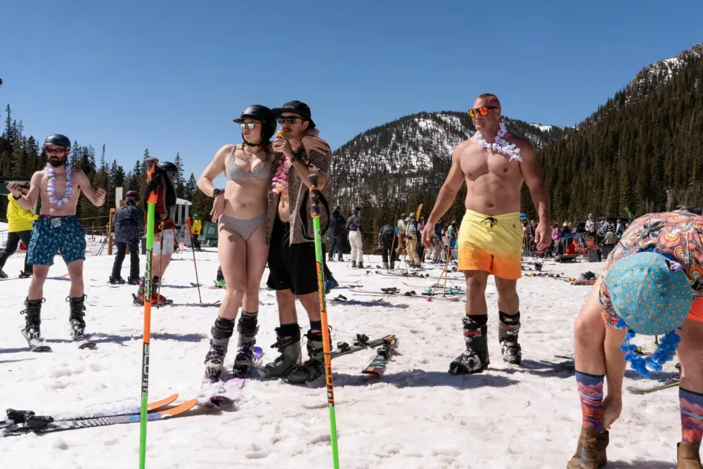 People take a break from skiing at Arapahoe Basin Ski Resort as temperatures reach into the upper 50 degrees Fahrenheit in Keystone, Colorado, U.S., March 21, 2026.  REUTERS/Cheney Orr