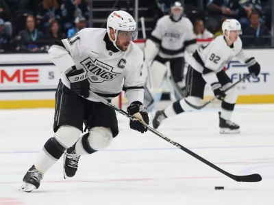Mar 22, 2026; Salt Lake City, Utah, USA; Los Angeles Kings center Anze Kopitar (11) skates with the puck against Utah Mammoth during the second period at Delta Center. Mandatory Credit: Rob Gray-Imagn Images