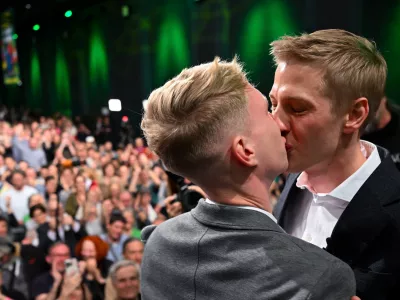 Dominik Krause, right, top candidate of the Green party, and his friend Sebastian M&uuml;ller, on stage at the Green Party election party after the run-off election for the office of Lord Mayor in the Bavarian capital of Munich, Germany, Sunday, March 22, 2026. (Sven Hoppe/dpa via AP)