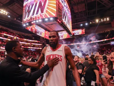 Mar 21, 2026; Houston, Texas, USA; A fan pats Houston Rockets forward Kevin Durant (7) on the chest after the game against the Miami Heat at Toyota Center. Mandatory Credit: Thomas Shea-Imagn Images