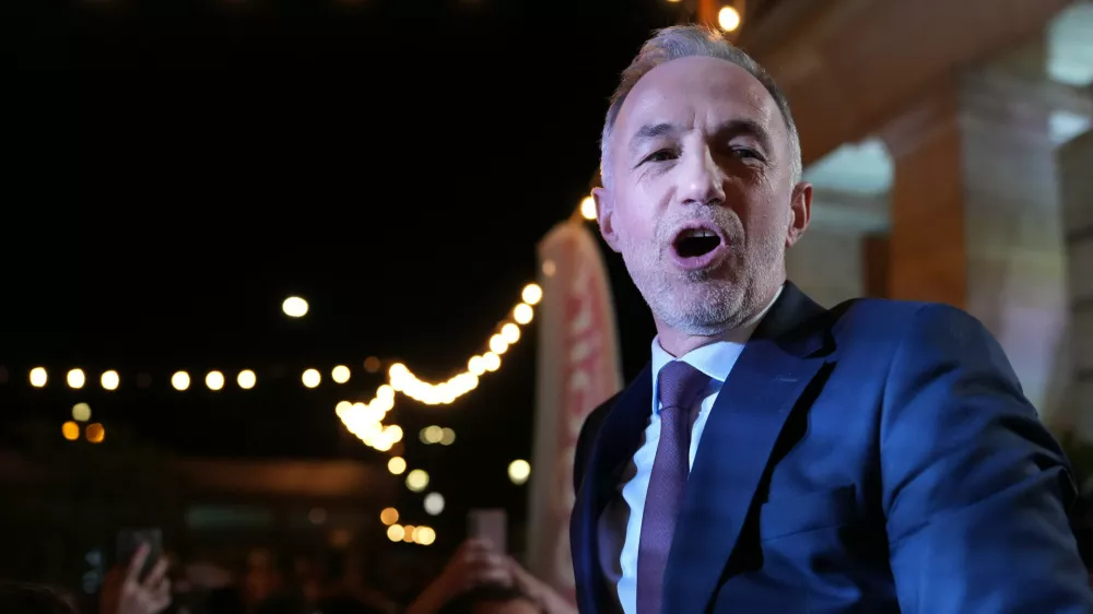 French socialist candidate for Paris mayoral election Emmanuel Gregoire celebrates after he won the second round of France's municipal elections in Paris, France, Sunday, March 22, 2026. (AP Photo/Thibault Camus)