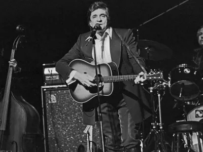 American country singer and song writer Johnny Cash performing at Hamburg, Germany, circa 1981. (Photo by Helmut Reiss/United Archives via Getty Images)