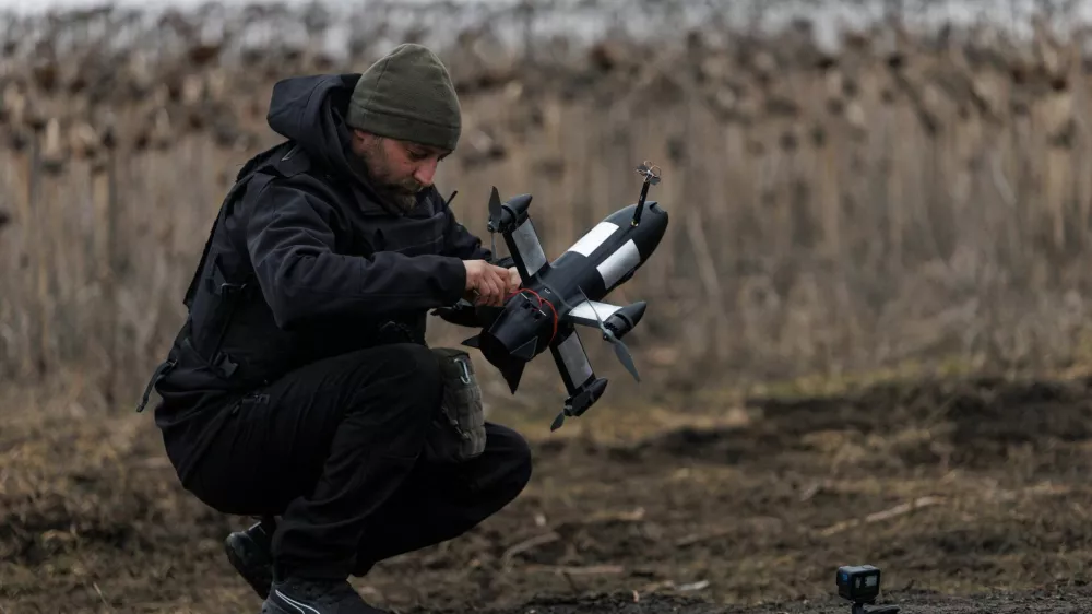 Yuriy, a service member of an air defence unit of the 420th Khort Separate Unmanned Systems Battalion prepares a P1-Sun FPV interceptor drone for a launch during his combat shift, amid Russia's attack on Ukraine, in Kharkiv region, Ukraine March 18, 2026. REUTERS/Valentyn Ogirenko
