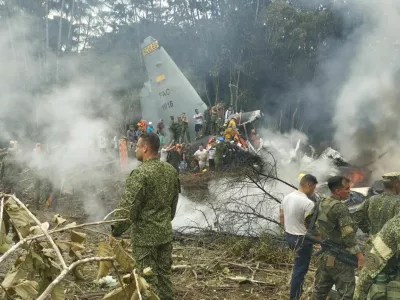 Members of the military gather at the site of a Colombian military plane crash in Puerto Leguizamo, Putumayo, Colombia March 23, 2026. La Voz de Amazonia/Mare Rafue/Handout via REUTERS  THIS IMAGE HAS BEEN SUPPLIED BY A THIRD PARTY. MANDATORY CREDIT  VERIFICATION: Topography mapping and nearby buildings matched satellite imagery Date verified by original file metadata Defense Minister Pedro Sanchez said the accident happened as the Lockheed Martin-built LMT.N Hercules C-130 was taking off from Puerto Leguizamo on the border with Peru