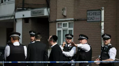 Police work near the scene, after four ambulances belonging to Hatzola, a Jewish community organisation, were set on fire in an incident that the police say is being treated as an antisemitic hate crime, in northwest London, Britain, March 23, 2026. REUTERS/Isabel Infantes