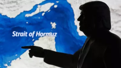 A map showing the Strait of Hormuz and a 3D-printed miniature model depicting U.S. President Donald Trump are seen in this illustration taken March 23, 2026. REUTERS/Dado Ruvic/Illustration