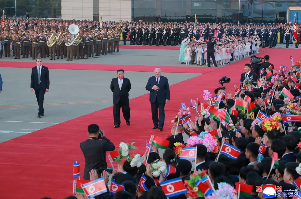 In this photo provided by the North Korean government, its leader Kim Jong Un, center left, sends Belarus' President Alexander Lukashenko off at Pyongyang international airport, North Korea Thursday, March 26, 2026. Independent journalists were not given access to cover the event depicted in this image distributed by the North Korean government. The content of this image is as provided and cannot be independently verified. Korean language watermark on image as provided by source reads: "KCNA" which is the abbreviation for Korean Central News Agency. (Korean Central News Agency/Korea News Service via AP)