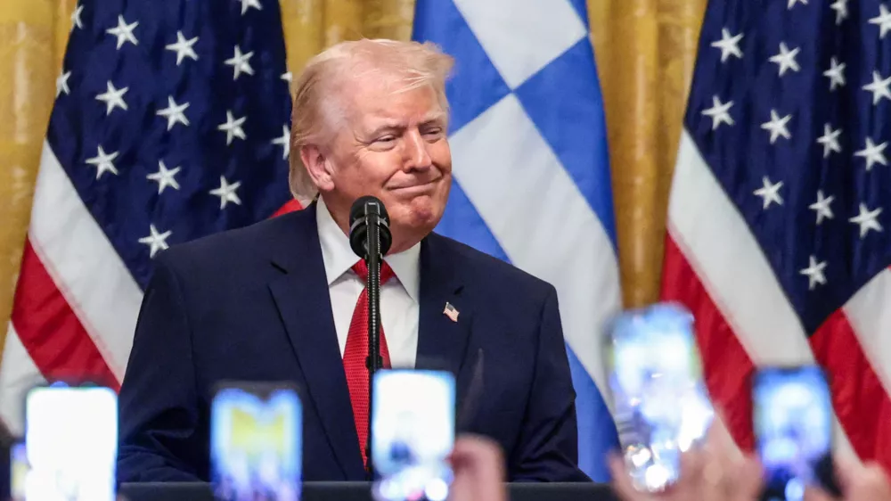 U.S. President Donald Trump attends a celebration in honor of Greek Independence Day in the East Room of the White House in Washington, D.C., U.S., March 26, 2026. REUTERS/Evelyn Hockstein