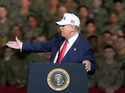U.S. President Donald Trump speaks to the soldiers and servicemen during his visit to the USS George Washington at the U.S. Navy's Yokosuka base in Yokosuka, south of Tokyo, Tuesday, Oct. 28, 2025. (AP Photo/Eugene Hoshiko)