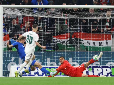 Soccer Football - International Friendly - Hungary v Slovenia - Puskas Arena, Budapest, Hungary - March 28, 2026 Slovenia's Igor Vekic in action as he makes a save from Hungary's Roland Sallai REUTERS/Bernadett Szabo