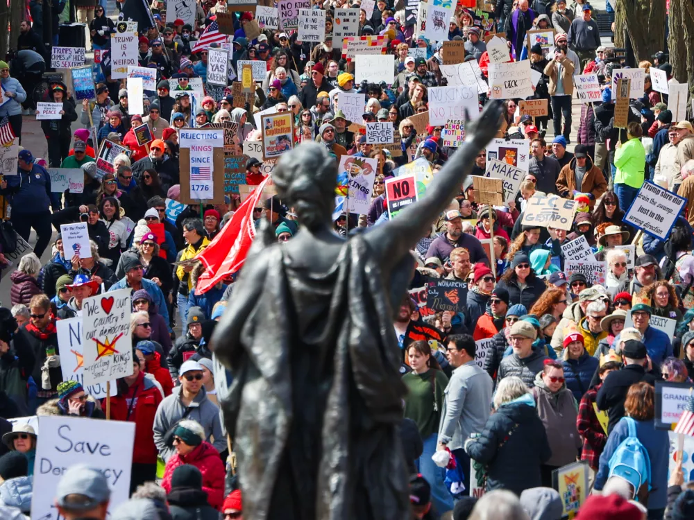 Protestors march up State Street at the Wisconsin State Capitol during the "No Kings" march in Madison, Wis., on Saturday, March 28, 2026. (Owen Ziliak/Wisconsin State Journal via AP)