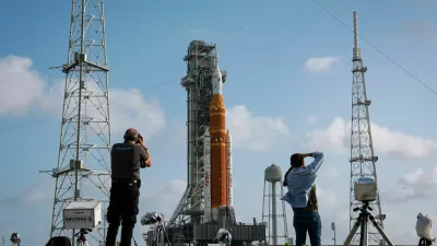 People photograph NASA's next-generation moon rocket, the Space Launch System (SLS) rocket with the Orion crew capsule, on Pad 39B ahead of the Artemis II mission launch at the Kennedy Space Center in Cape Canaveral, Florida, U.S., March 29, 2026. REUTERS/Brendan McDermid