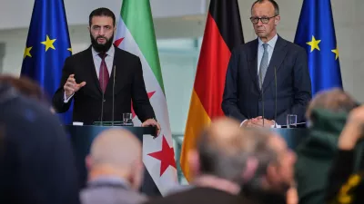German Chancellor Friedrich Merz, right, and Syrian President Ahmad al-Sharaa attend a press conference in Berlin, Germany, Monday, March 30, 2026. (AP Photo/Markus Schreiber)