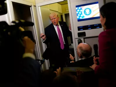 U.S. President Donald Trump talks to members of the media aboard Air Force One en route to Joint Base Andrews, Maryland, U.S., March 29, 2026. REUTERS/Elizabeth Frantz