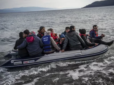 FILED - 28 February 2020, Greece, Lesbos: Refugees in a lifeboat arrive on the Greek island of Lesbos after crossing the Aegean Sea with other migrants from Turkey. A passing freighter rescued 68 migrants whose boat was in distress off the Greek island of Kalymnos on Monday morning, Greek media reported. Photo: Angelos Tzortzinis/dpa