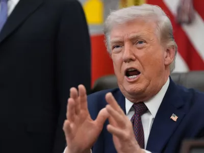 President Donald Trump answers questions from reporters after signing an executive order in the Oval Office of the White House Tuesday, March 31, 2026, in Washington. (AP Photo/Alex Brandon)