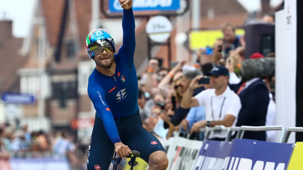 19 September 2021, Belgium, Bruges: Italian cyclist Filippo Ganna of Ineos Grenadiers celebrates winning the men elite time trial race, 43.3 km from Knokke-Heist to Brugge, at the 2021 UCI Road World Championships. Photo: Kurt Desplenter/BELGA/dpa