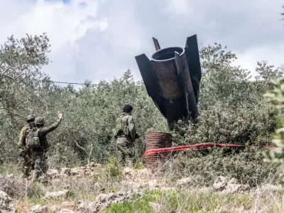 Soldiers seen inspecting a missile fragment. A huge fragment of the Iranian ballistic missile landed in the rural area, central Israel, with out causing any damage.