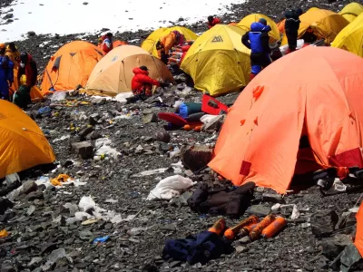 BEIJING, June 17, 2012 Photo taken on March 12, 2008 shows camps and discarded wastes in the Sagarmatha (Mt. Qomolangma) National Park in Nepal.. Since human beings first conquered Mt. Qomolangma, the world's highest mountain, people have expressed concern about its environment as lots of human wastes, climbing gears and other rubbish were discarded on the summit. Mt. Qomolangma was even dubbed as ''the world's highest garbage dump''.. In 1991, the Sagarmatha Pollution Control Committee (SPCC), was set up to control the pollution. With tourist expedition booming, more and more trekkers and climbers throng into the Himalayas, laying a long siege to Mt. Qomolangma, where wastes, such as plastic, papers, empty oxygen cylinders, cans, bottles, helicopter debris and metals, can be found everywhere.. ''More tourists mean we have to clean up more garbages. We have been seeking a solution to the pollution, which at present is not a big trouble-maker, but the challenge keeps mounting up,'' said Ang Dorjee Sherpa, chairman of the SPCC.,Image: 131400718, License: Rights-managed, Restrictions:, Model Release: no