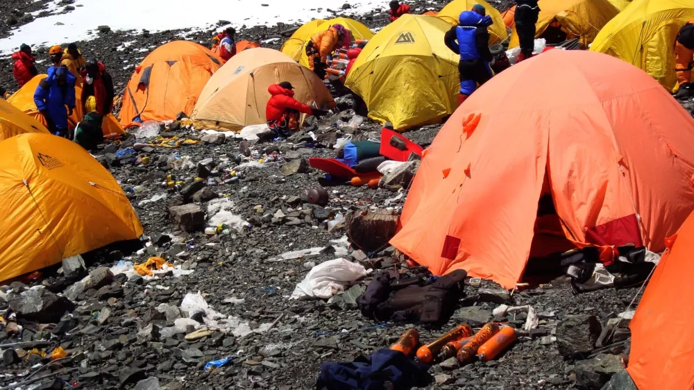 BEIJING, June 17, 2012 Photo taken on March 12, 2008 shows camps and discarded wastes in the Sagarmatha (Mt. Qomolangma) National Park in Nepal.. Since human beings first conquered Mt. Qomolangma, the world's highest mountain, people have expressed concern about its environment as lots of human wastes, climbing gears and other rubbish were discarded on the summit. Mt. Qomolangma was even dubbed as ''the world's highest garbage dump''.. In 1991, the Sagarmatha Pollution Control Committee (SPCC), was set up to control the pollution. With tourist expedition booming, more and more trekkers and climbers throng into the Himalayas, laying a long siege to Mt. Qomolangma, where wastes, such as plastic, papers, empty oxygen cylinders, cans, bottles, helicopter debris and metals, can be found everywhere.. ''More tourists mean we have to clean up more garbages. We have been seeking a solution to the pollution, which at present is not a big trouble-maker, but the challenge keeps mounting up,'' said Ang Dorjee Sherpa, chairman of the SPCC.,Image: 131400718, License: Rights-managed, Restrictions:, Model Release: no