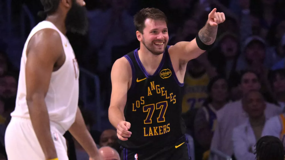 Mar 31, 2026; Los Angeles, California, USA; Los Angeles Lakers guard Luka Doncic (77) reacts after a basket in the second half against the Cleveland Cavaliers at Crypto.com Arena. Mandatory Credit: Jayne Kamin-Oncea-Imagn Images