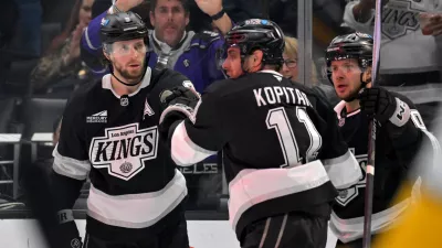 Los Angeles Kings right wing Adrian Kempe (9) is congratulated by Kings' center Anze Kopitar after scoring a goal during the second period of an NHL hockey game against the Nashville Predators, Thursday, April 2, 2026, in Los Angeles. (AP Photo/Jayne Kamin-Oncea)
