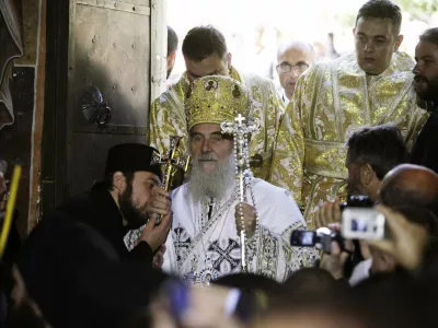 Newly elected Serbian Patriarch Irinej, flanked by Serbian Orthodox monks, arrives at the Patriarchate of Pec in Western Kosovo October 3, 2010. Irinej, 80, was elected on January as the patriarch of the Serb Orthodox Church but his official enthronement had to take place at Pec patriarchate in Kosovo, Serbia's former province that declared independence in 2008. Thousands of Serbs and political leaders gathered on Sunday in Kosovo's western town of Pec to enthrone the new patriarch. REUTERS/Hazir Reka (KOSOVO - Tags: RELIGION POLITICS CIVIL UNREST)