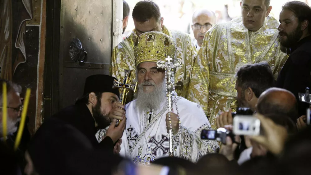 Newly elected Serbian Patriarch Irinej, flanked by Serbian Orthodox monks, arrives at the Patriarchate of Pec in Western Kosovo October 3, 2010. Irinej, 80, was elected on January as the patriarch of the Serb Orthodox Church but his official enthronement had to take place at Pec patriarchate in Kosovo, Serbia's former province that declared independence in 2008. Thousands of Serbs and political leaders gathered on Sunday in Kosovo's western town of Pec to enthrone the new patriarch. REUTERS/Hazir Reka (KOSOVO - Tags: RELIGION POLITICS CIVIL UNREST)