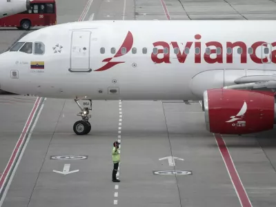 An Avianca plane sit on the tarmac at El Dorado airport in Bogota on November 28, 2025. Colombian airline Avianca reported on Friday "significant" disruptions to its flights due to a required Airbus software update affecting 70 percent of the company's fleet.,Image: 1055260627, License: Rights-managed, Restrictions:, Model Release: no