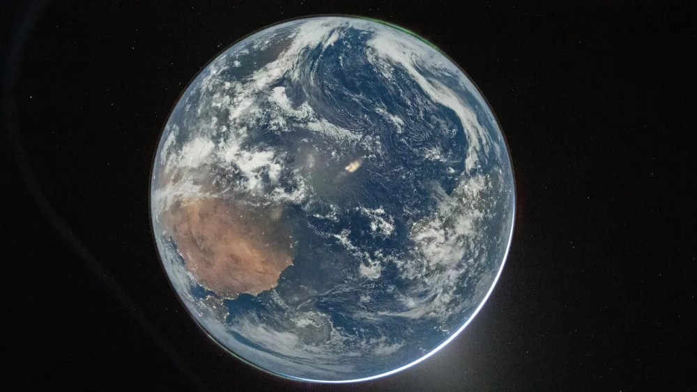 This image provided by NASA shows a view of Earth taken by NASA astronaut and Artemis II Commander Reid Wiseman from of the Orion spacecraft's window after completing the translunar injection burn on April 2, 2026. (NASA via AP)