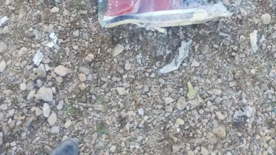 The Iranian state media said to show fragments of a downed U.S. jet in this picture said to be taken in central Iran and released on April 3, 2026. IRIB/Handout via REUTERS  THIS IMAGE HAS BEEN SUPPLIED BY A THIRD PARTY. IRAN OUT. NO COMMERCIAL OR EDITORIAL SALES IN IRAN. NO USE BBC PERSIAN. NO USE VOA PERSIAN. NO USE MANOTO. NO USE IRAN INTERNATIONAL. NO USE RADIO FARDA. REFILE - CORRECTING FROM "JETS" TO "JET" VERIFICATION: -Reuters was not able to confirm the location or date when the photos were taken. -The red stripe seen on the tail fin of the plane in the photos is consistent with the tail section of a F-15E Strike Eagle seen in file photos.